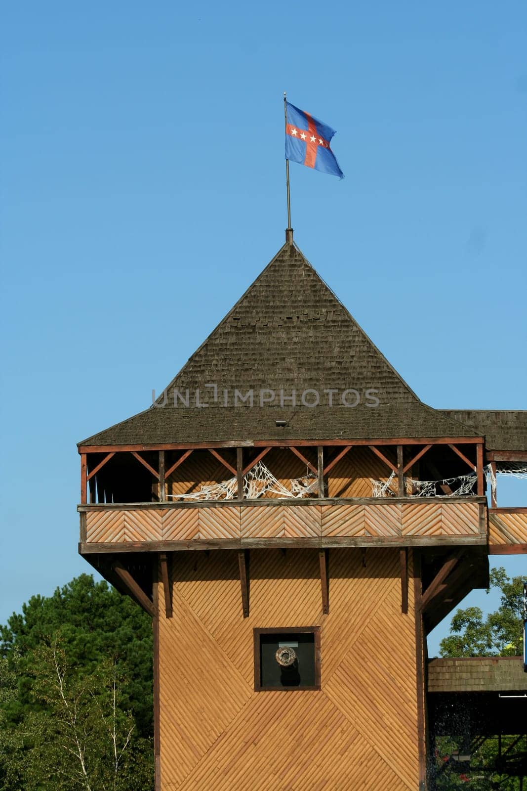 Old wooden fort against blue sky