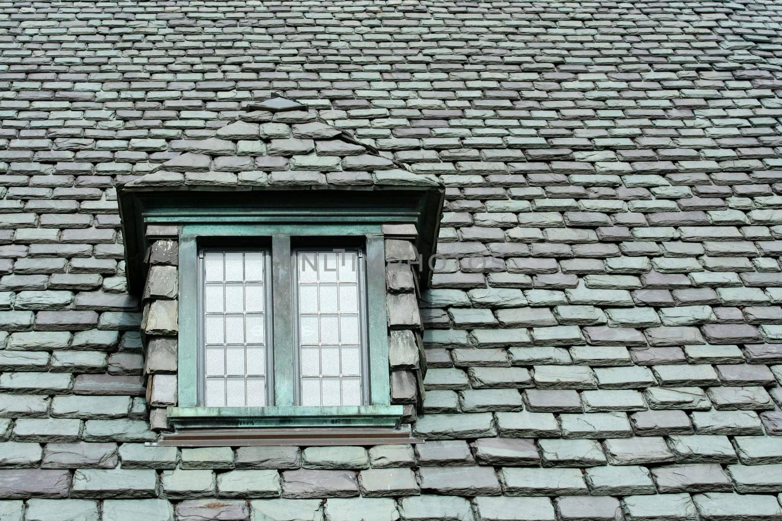A old slate roof with window