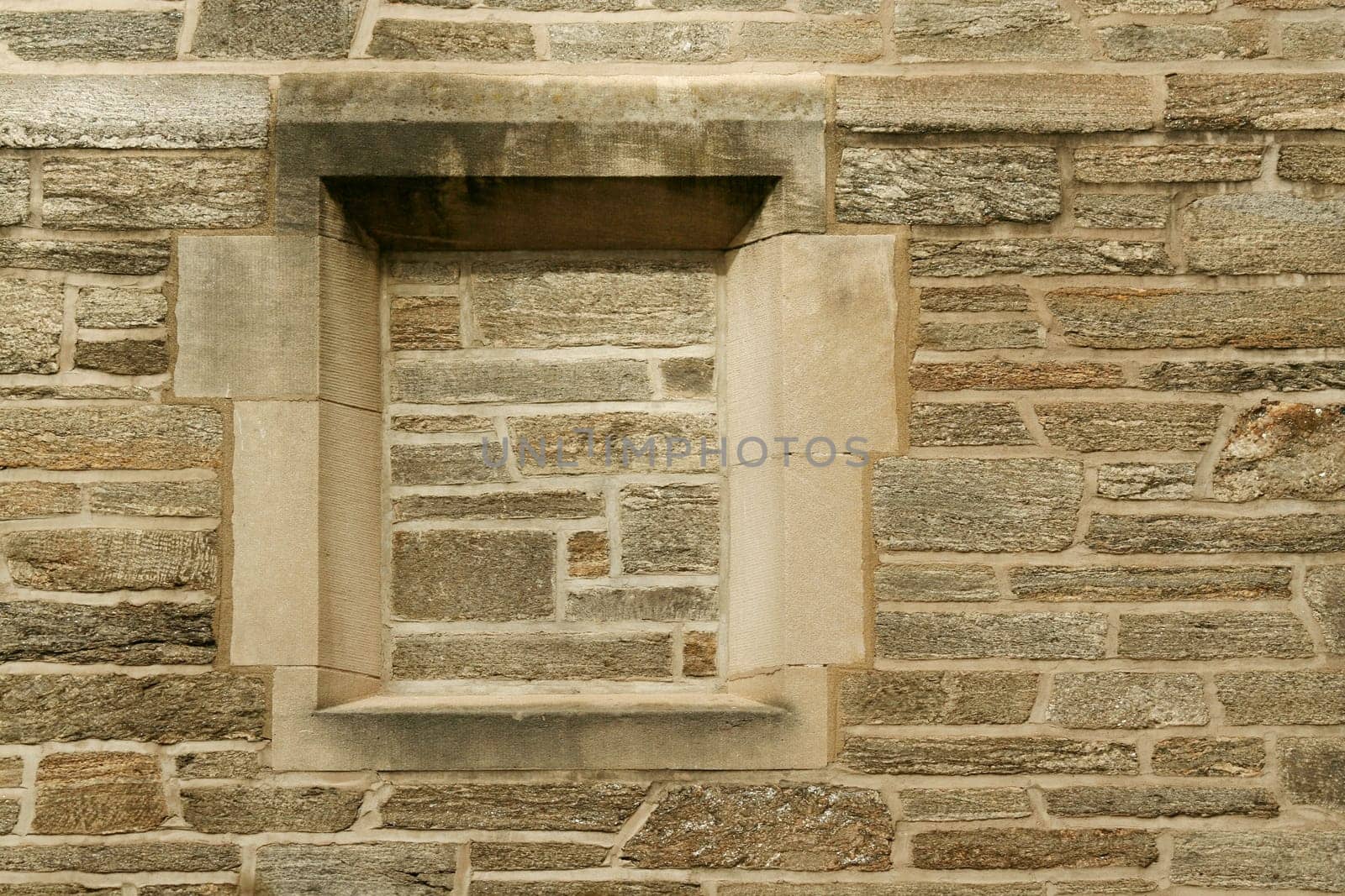 a window filled in with stone