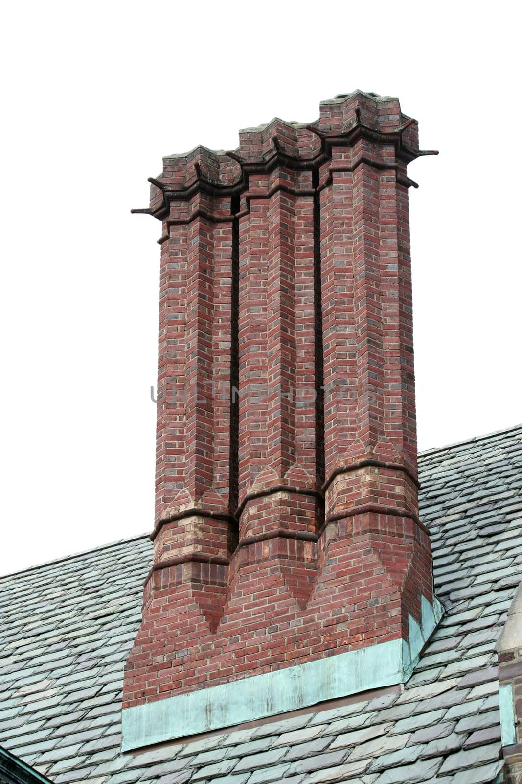 Some old chimneys on a roof