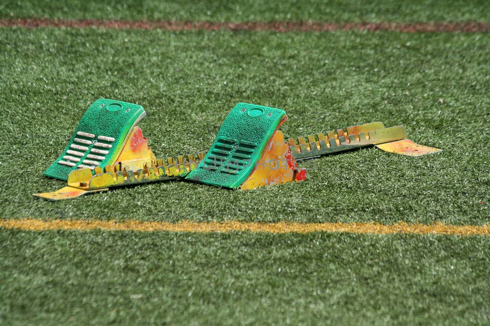 A set of starting block in the grass