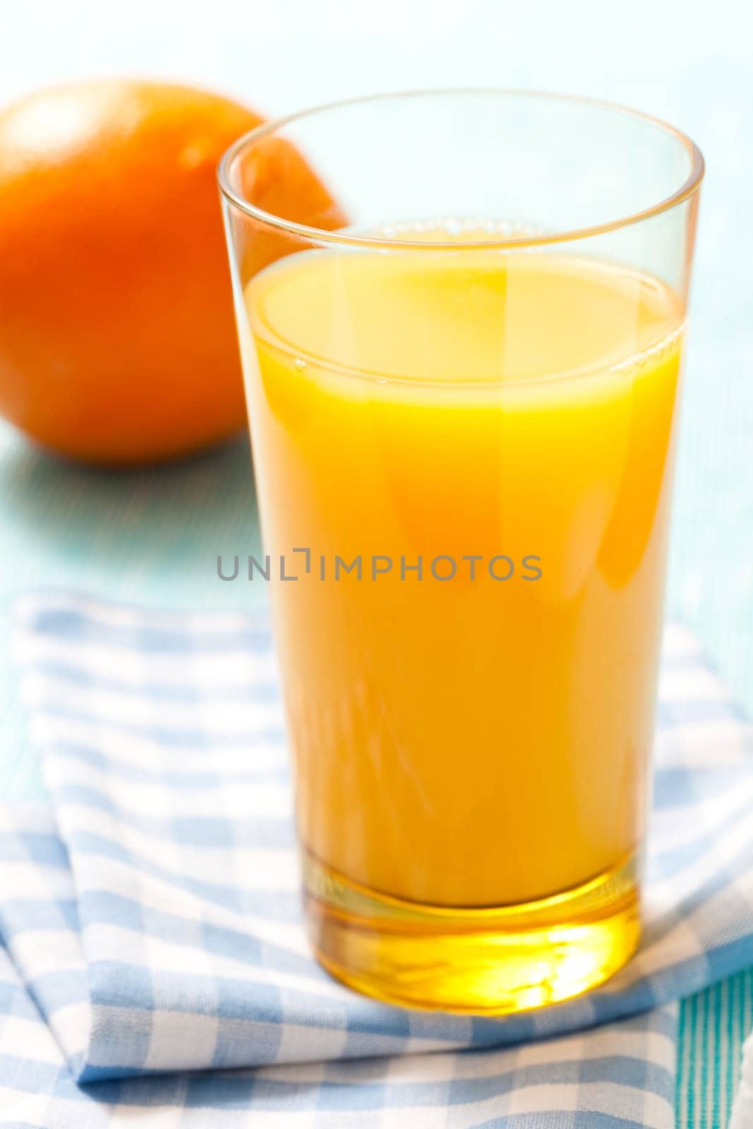 Fresh orange juice in a glass. Studio shot.
