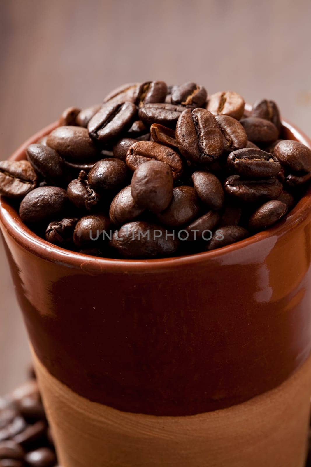 Close-up of coffee beans in a cup. Studio shot.