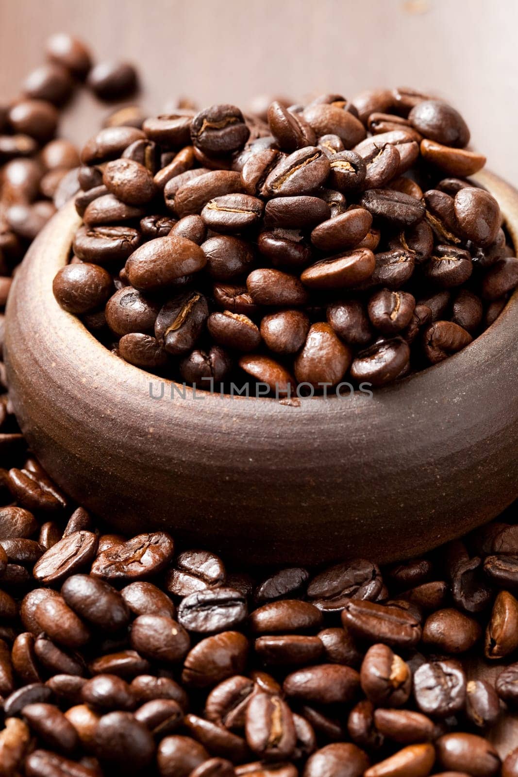 Close-up of coffee beans in a cup. Studio shot.