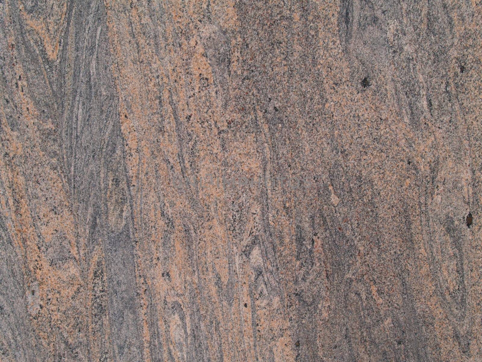 Marbled grained texture with a vertical grain in gray and tan colors.