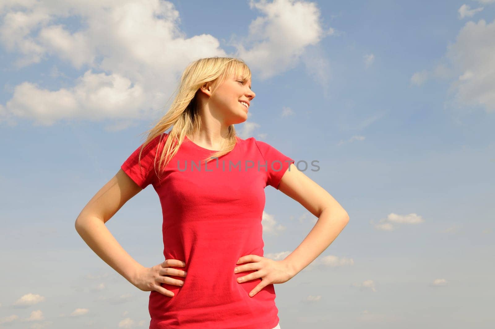 Laughing young woman looking to the side