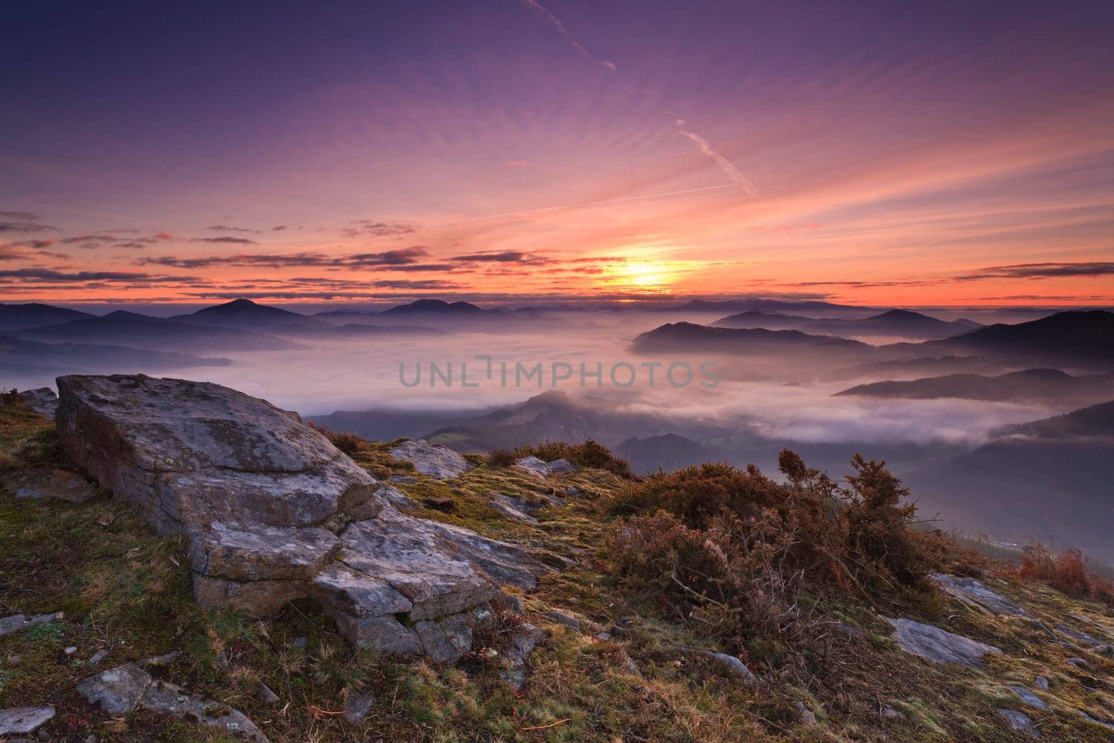 Mountains over the fog in the winter sunrise, Bizkaia, Spain