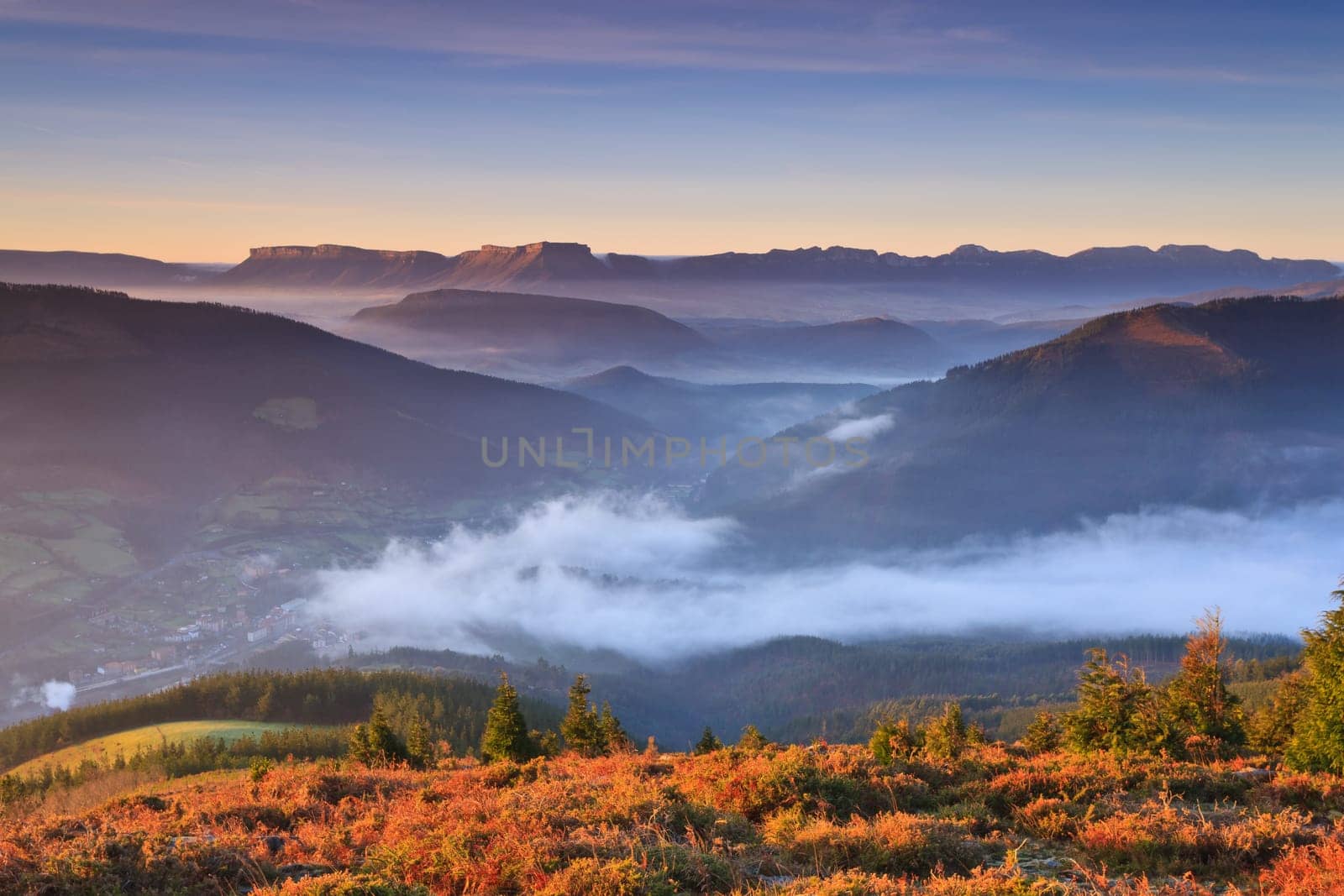 Mountains over the fog in the winter sunrise, Bizkaia, Spain