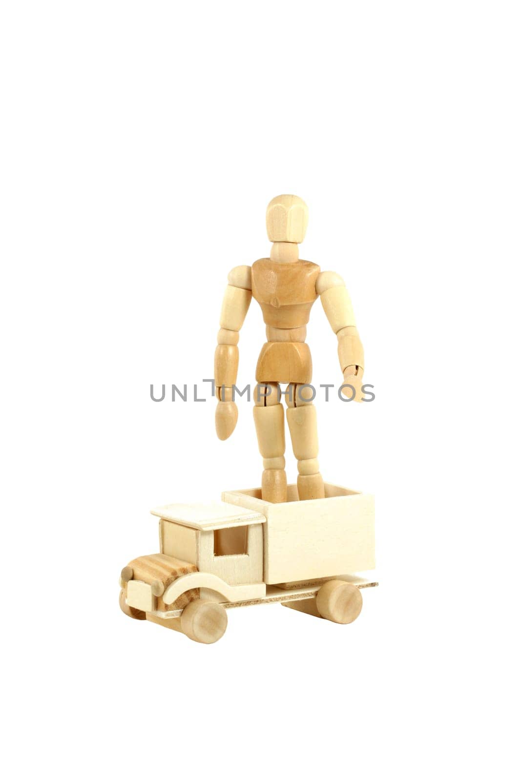 A Wooden manikin standing on truck