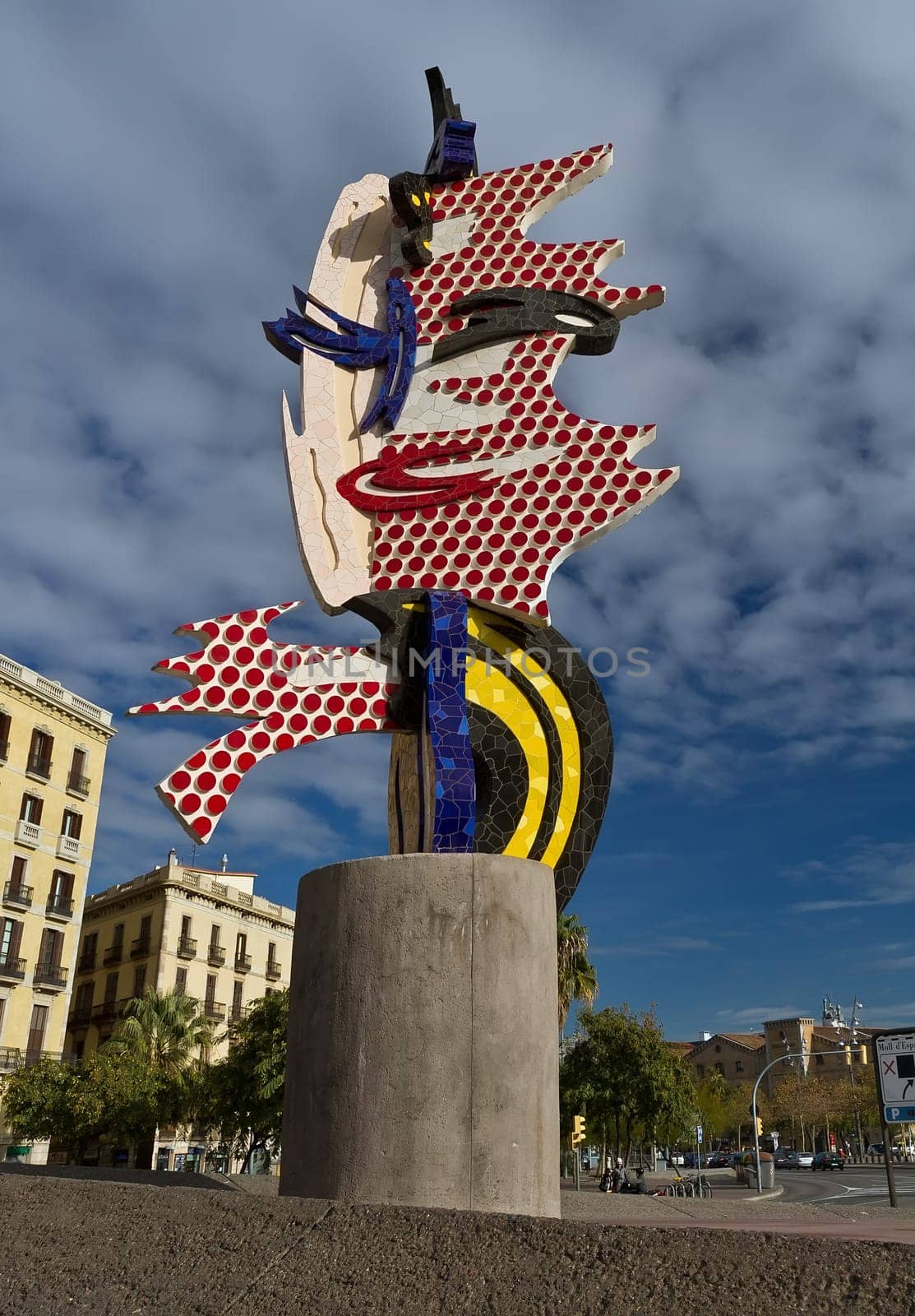 El Cap de Barcelona, 1991-1992, is a surrealist sculpture created by American Pop artist Roy Lichtenstein for the 1992 games in Barcelona, Spain. Its English title is "The Head"".  The sculpture was Lichtenstein&#039 s first outdoor work using ce"