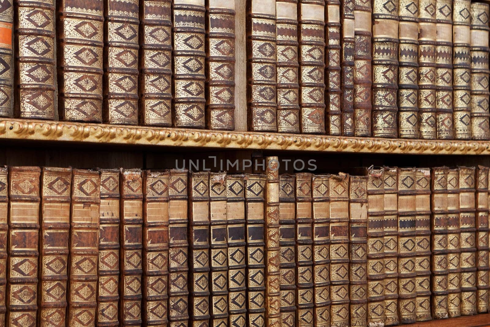Old antique books,with hard cover on a shelf