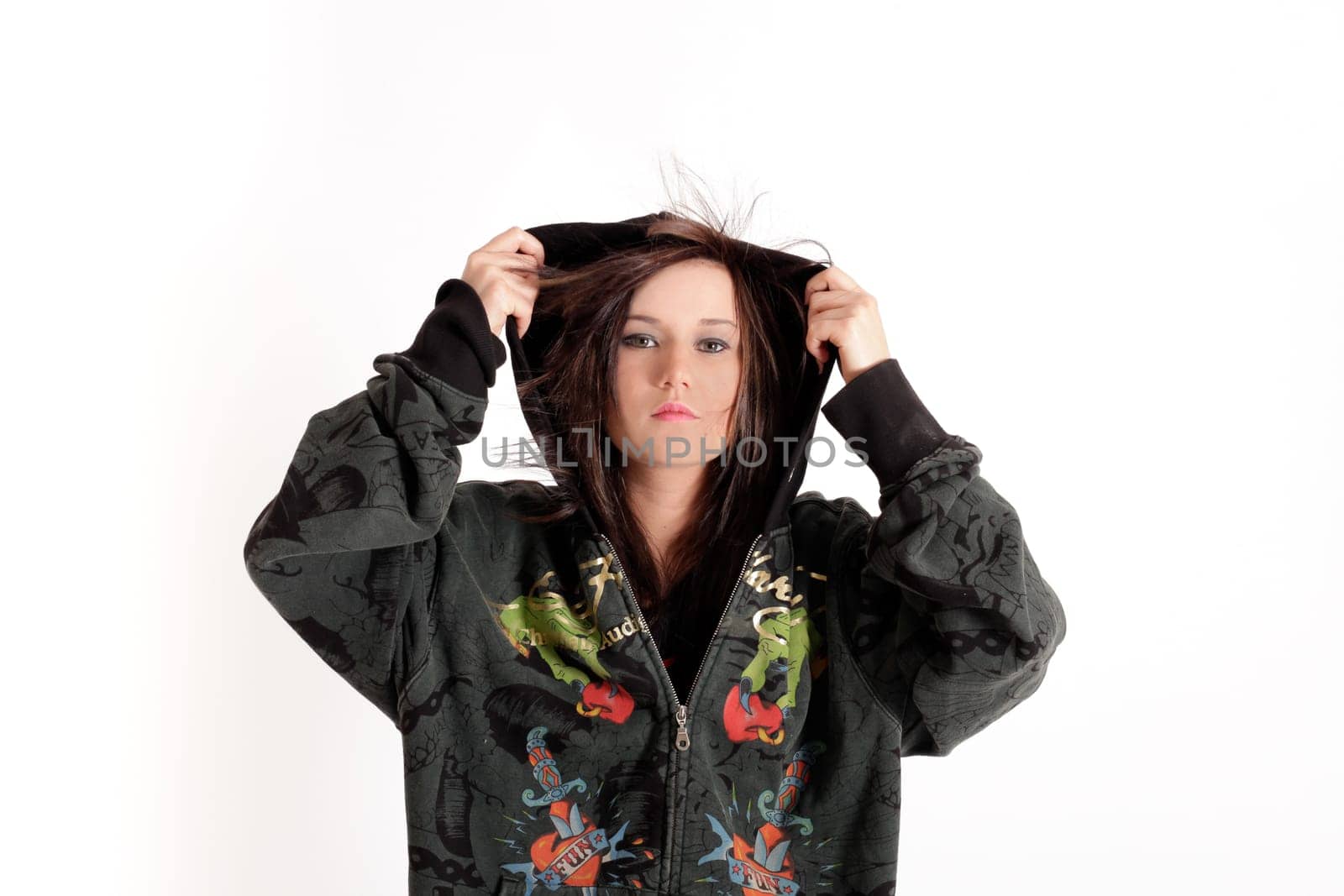 Young pretty teenage girl brunette in studio with long hair