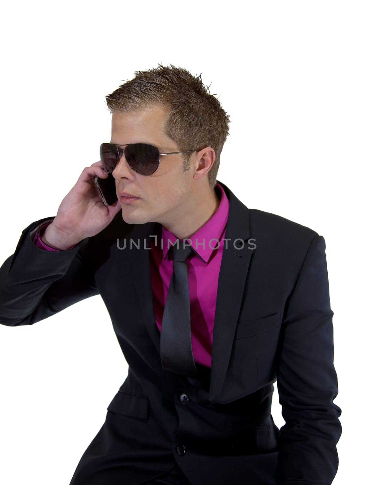 Young businessman holding a mobile phone