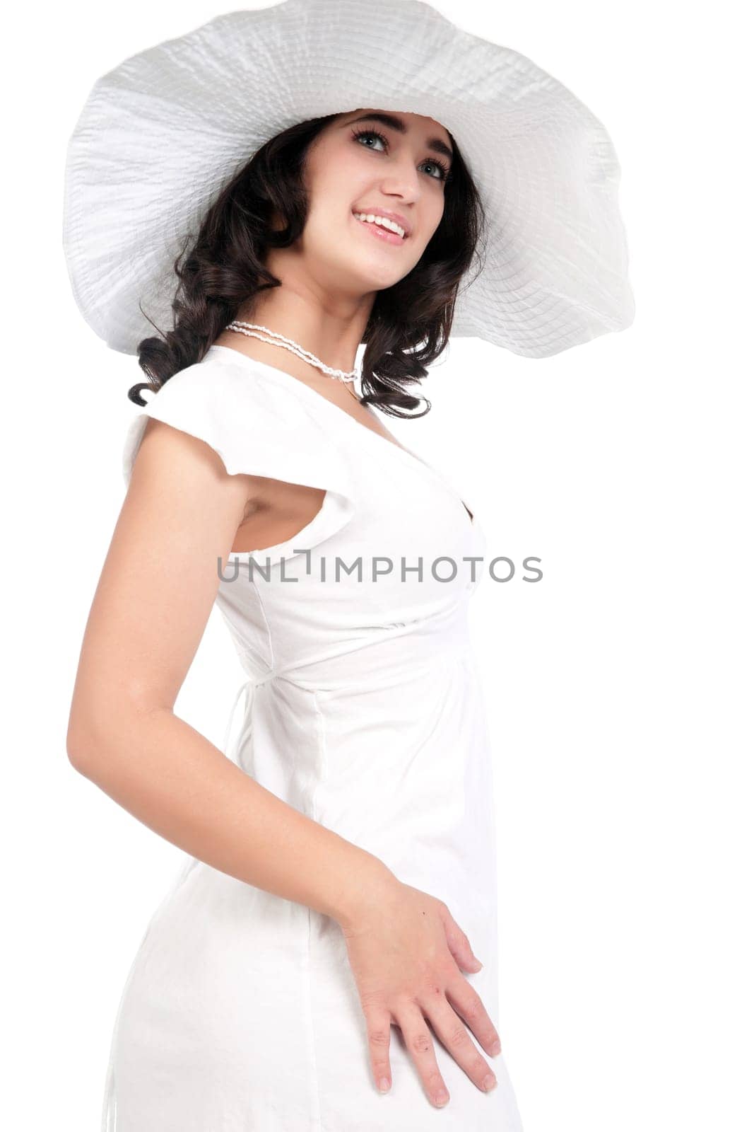 beautiful young fashion woman in white dress and hat