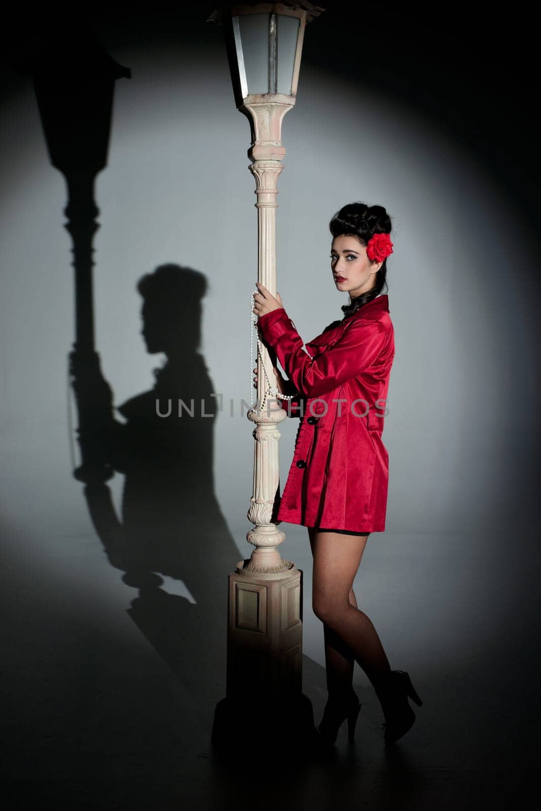 beautiful young glamorous woman  with lightpole