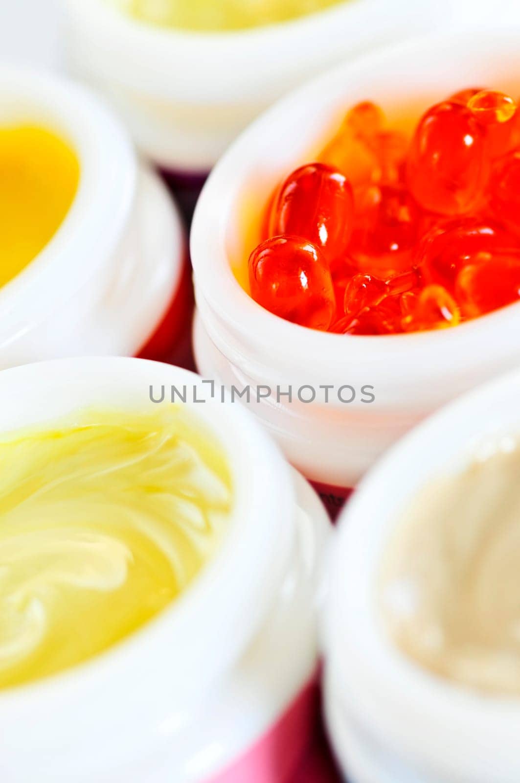 Colorful jars of skin care creams and lotions