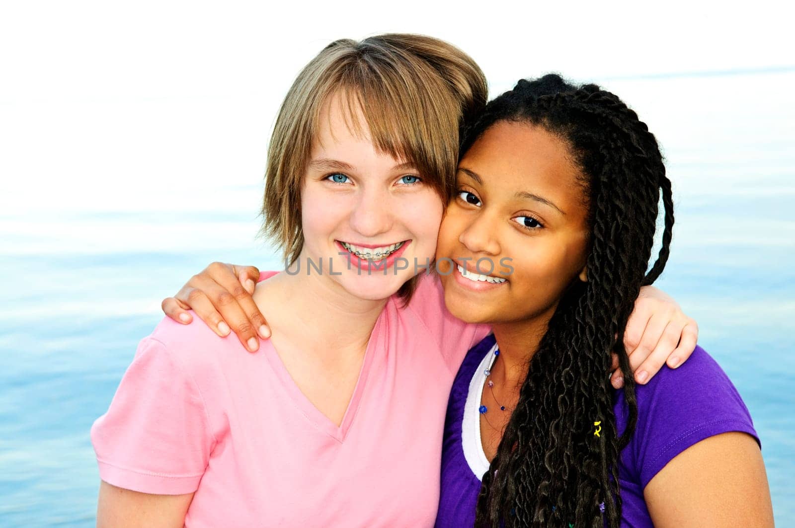 Portrait of two happy teenage girl friends