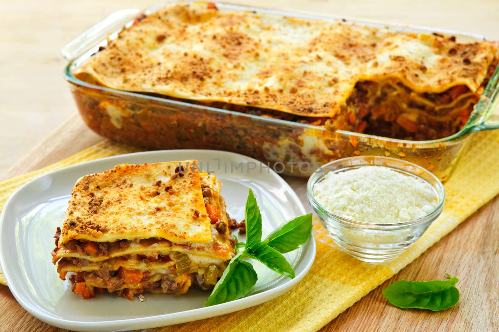 Fresh baked lasagna casserole with a serving cut