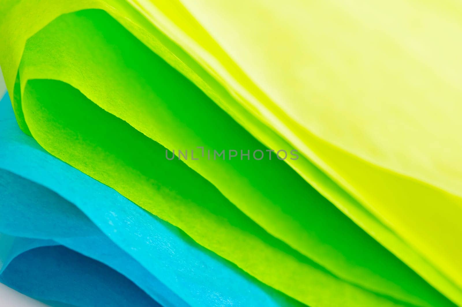 Close up of blue green and yellow tissue paper