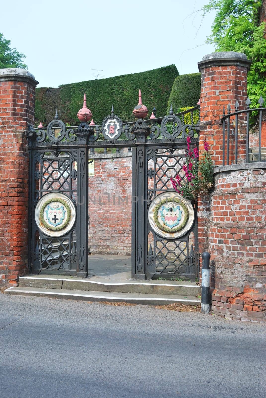 Wrought ironm gates showing seckford coat of arms