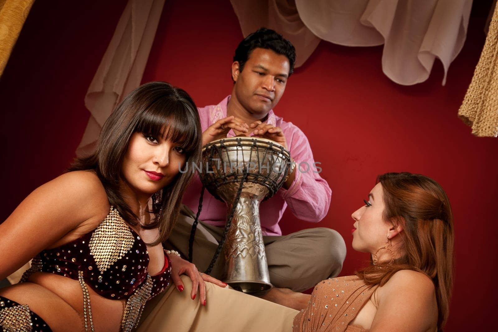 Two gorgeous Arab belly dancers with Indian man playing Sitar