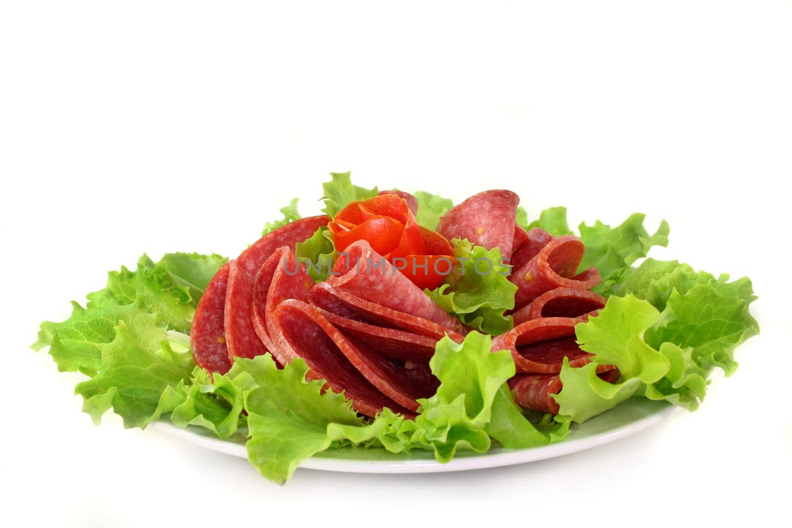 a plate of salami and garnish