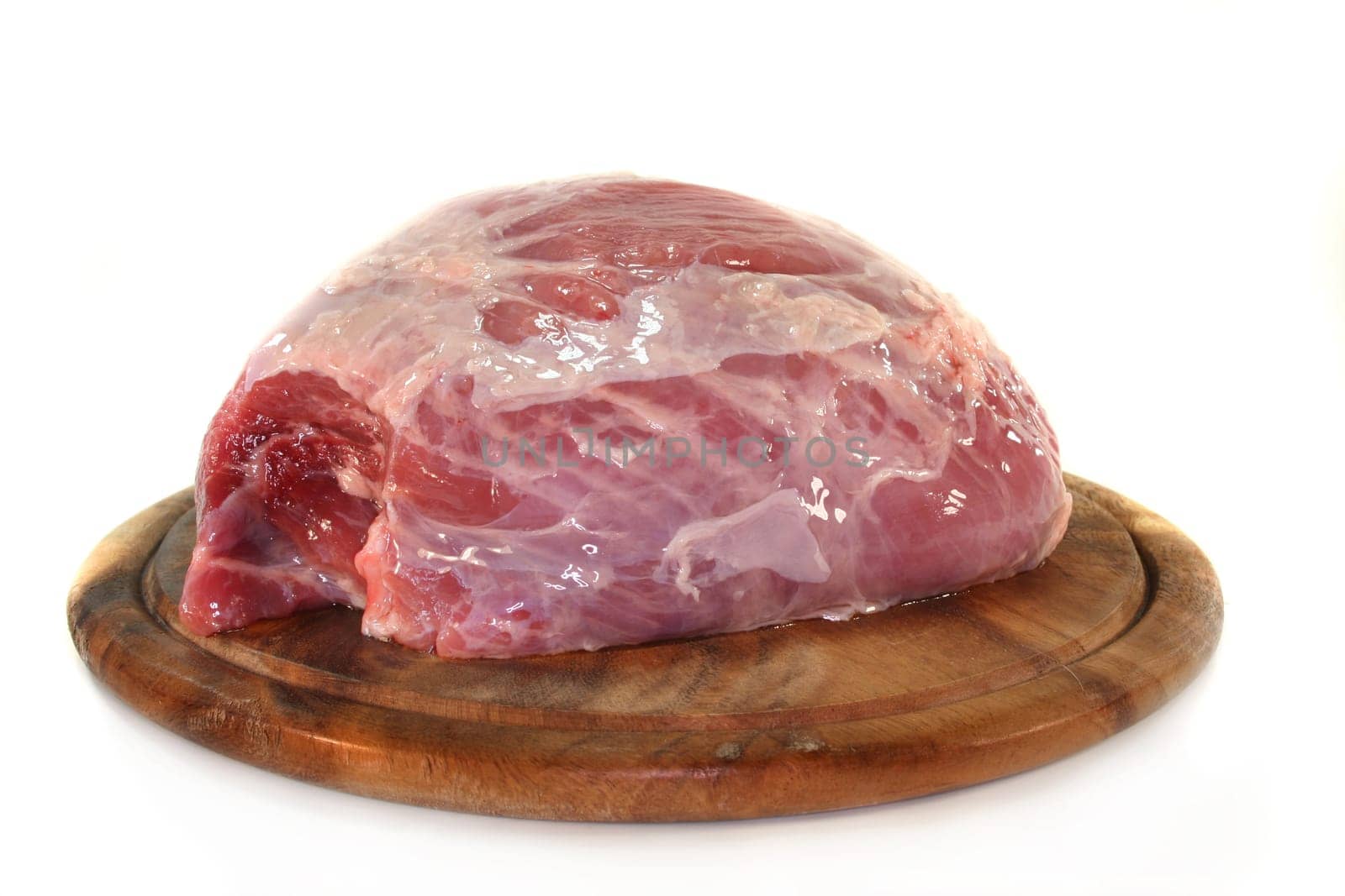 a piece of pork nut on a wooden board