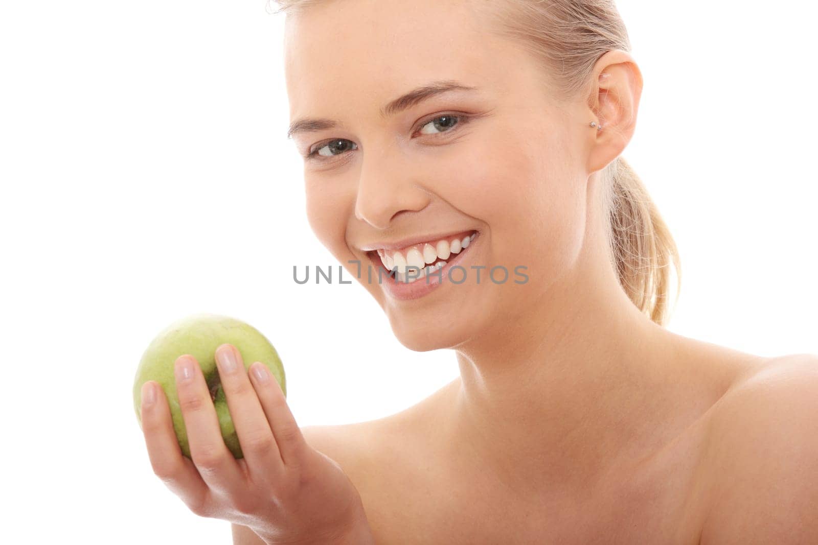 Beautiful girl eating green apple isolated on white background