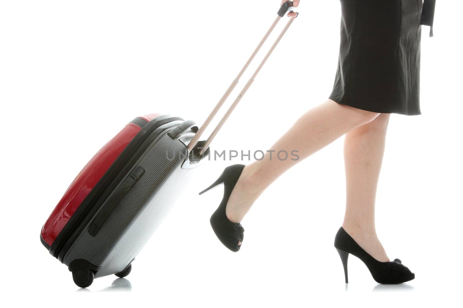 Businesswoman legs with a suitcase on the white background