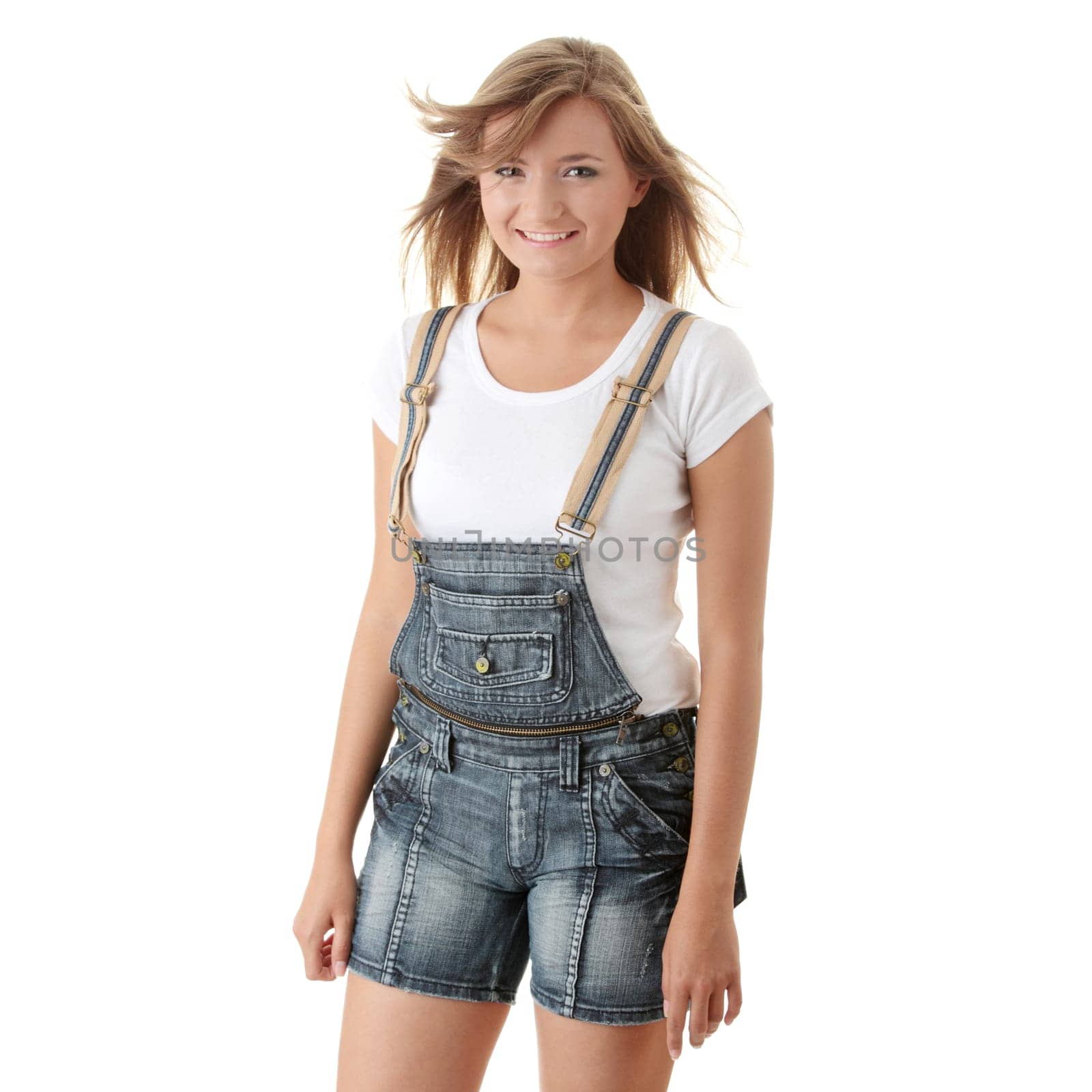 Young happy summer caucasian girl in shorts isolated on white background