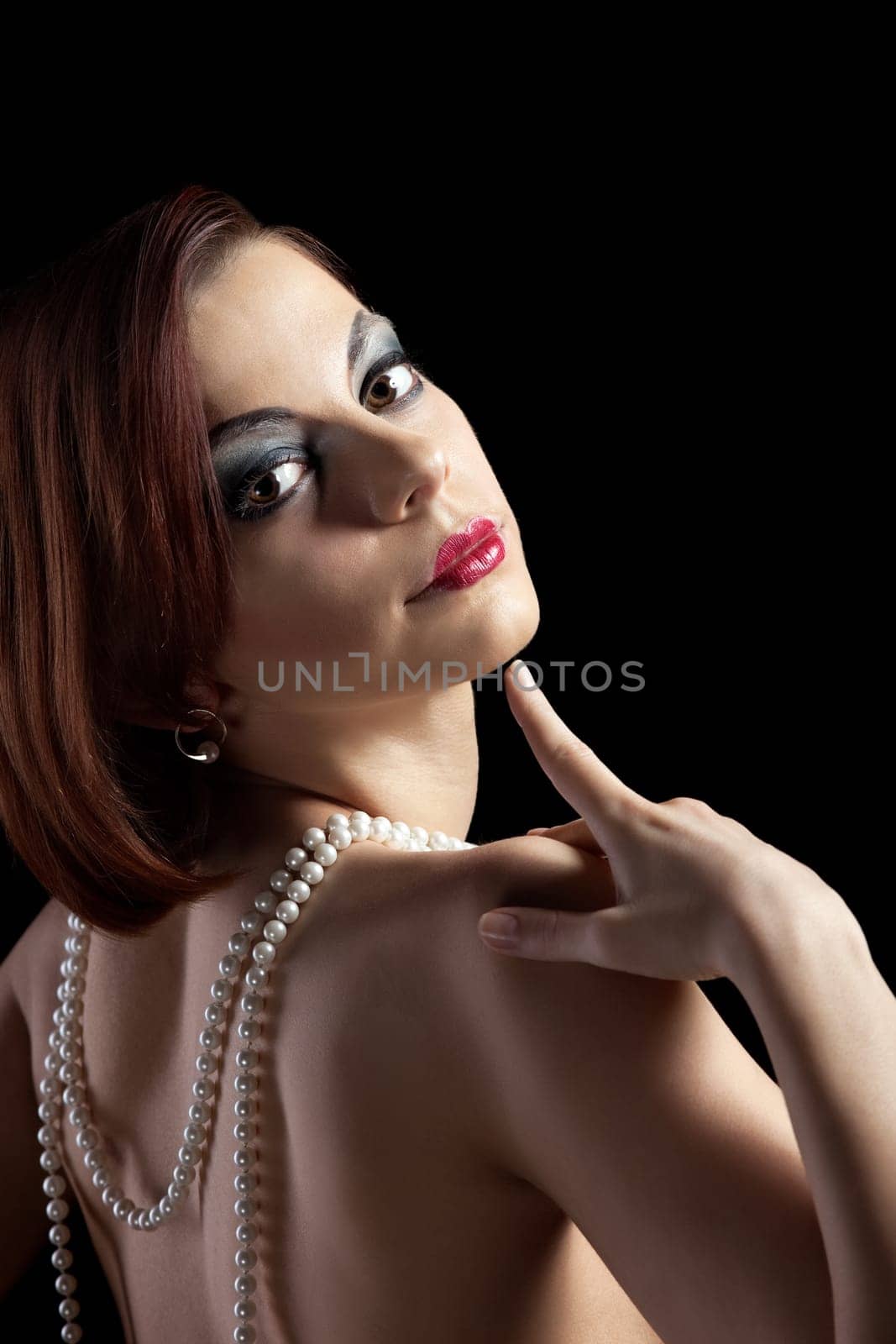 Woman portrait with fur boa in retro style make-up