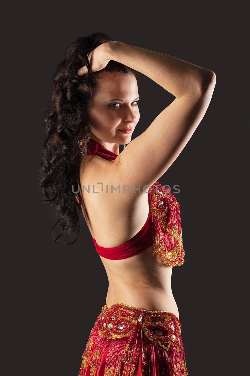 Woman dance in red traditional arabic costume
