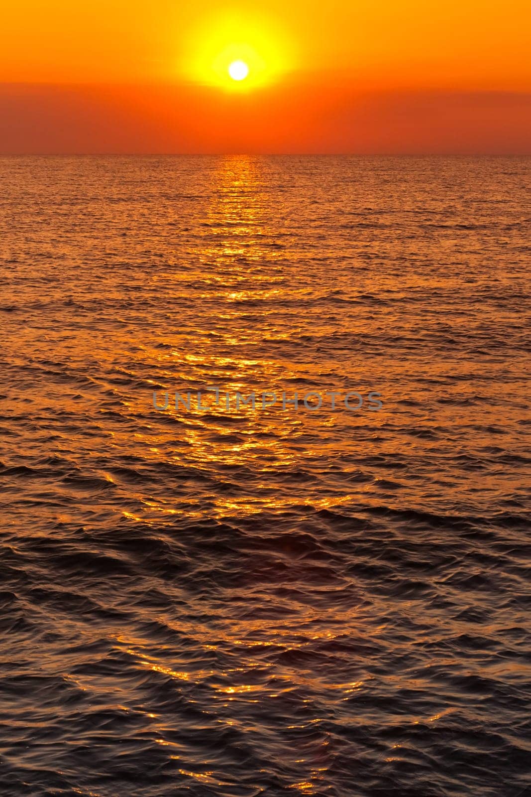 reflection of sunlight on the water at sunrise