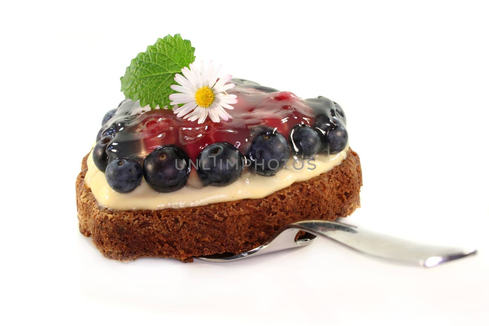 a forest fruit tart on a cake server
