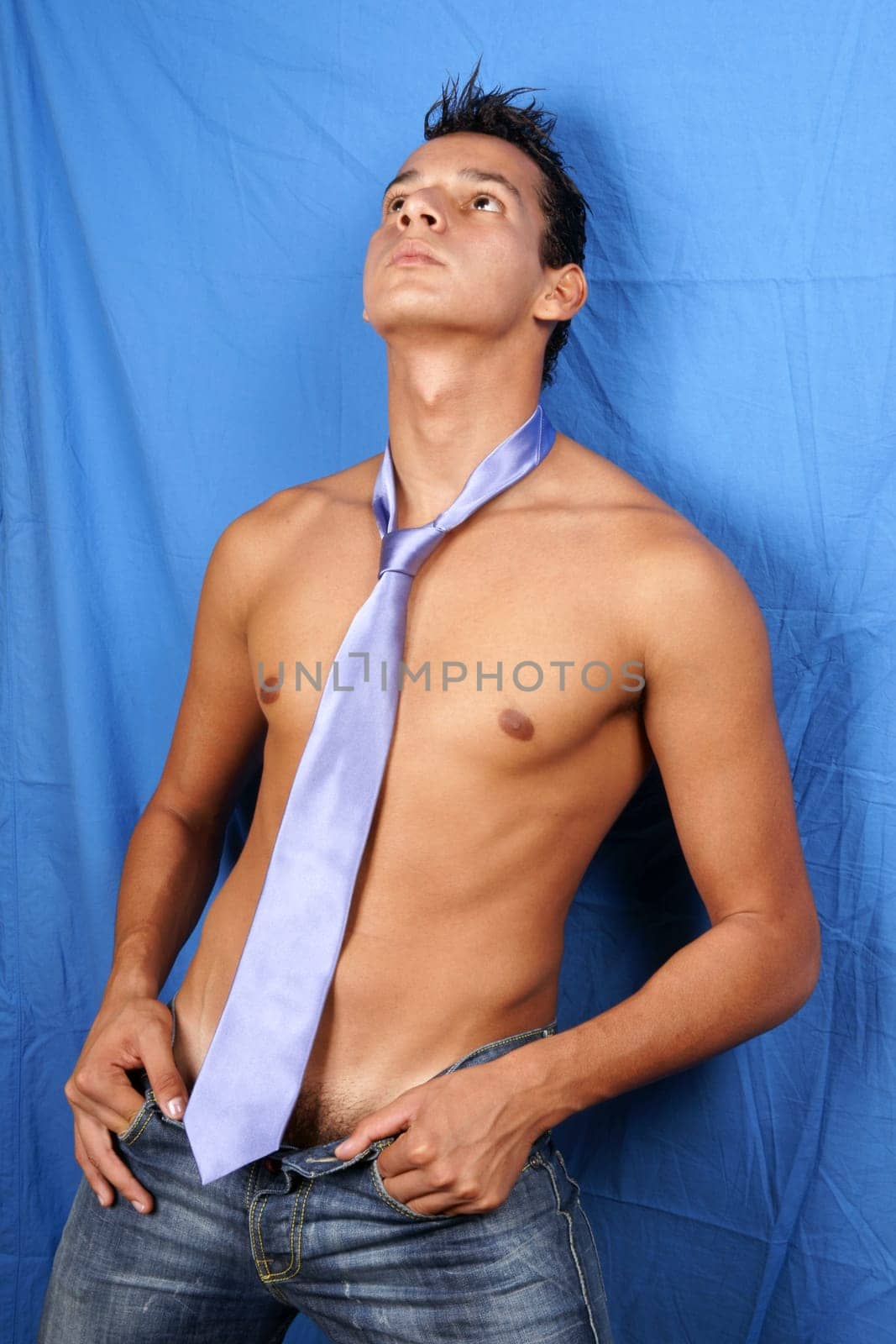 Sexy shirtless young brazilian man with tie
