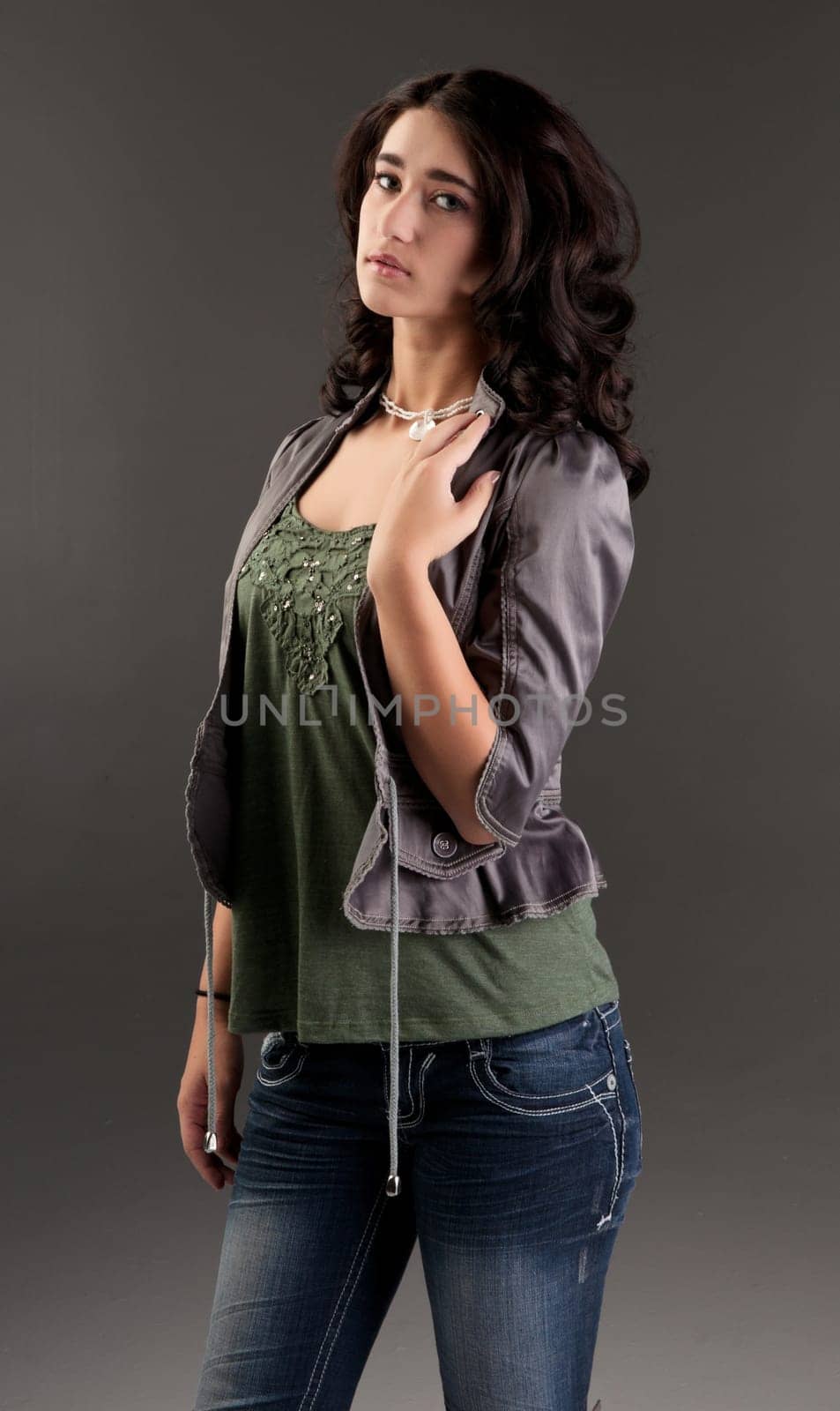 beuatiful young fashion teenager on dark gray