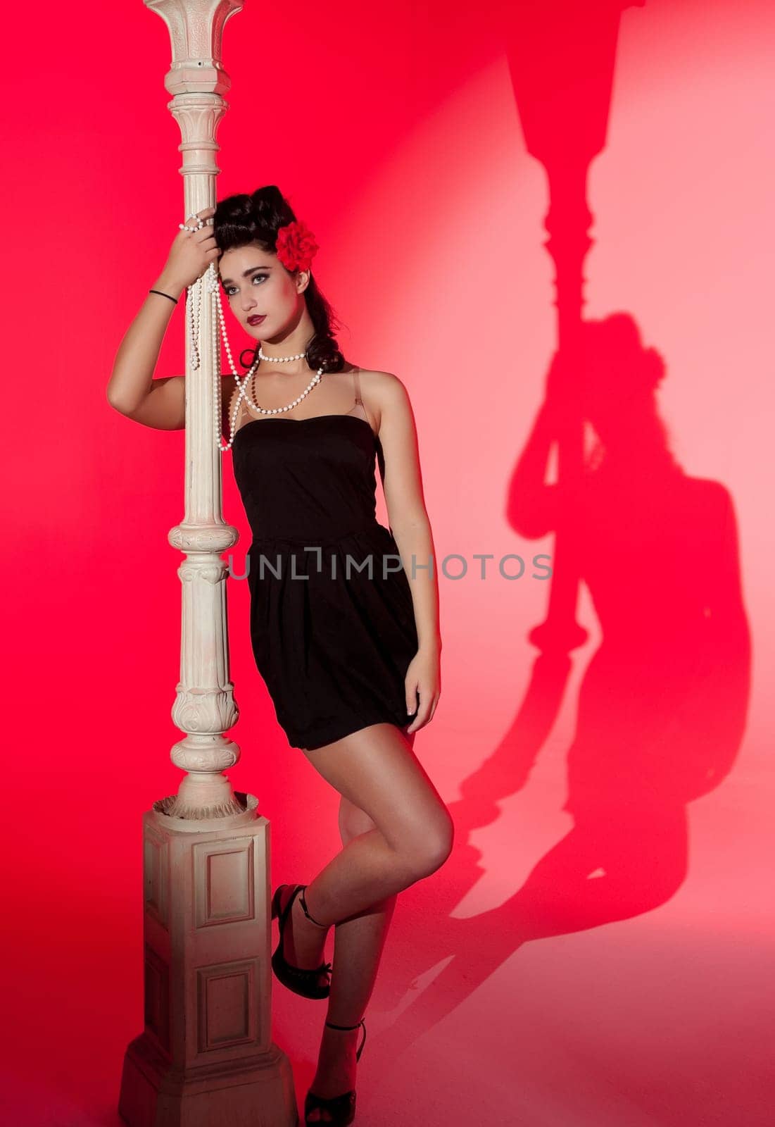 beautiful young glamorous woman  with lightpole