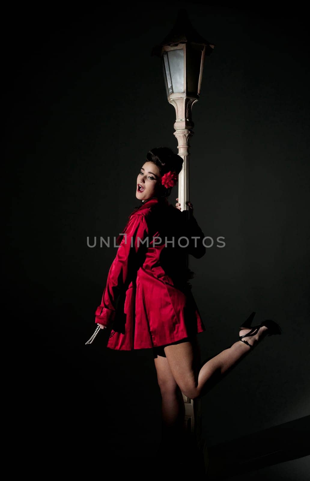 beautiful young glamorous woman  with lightpole