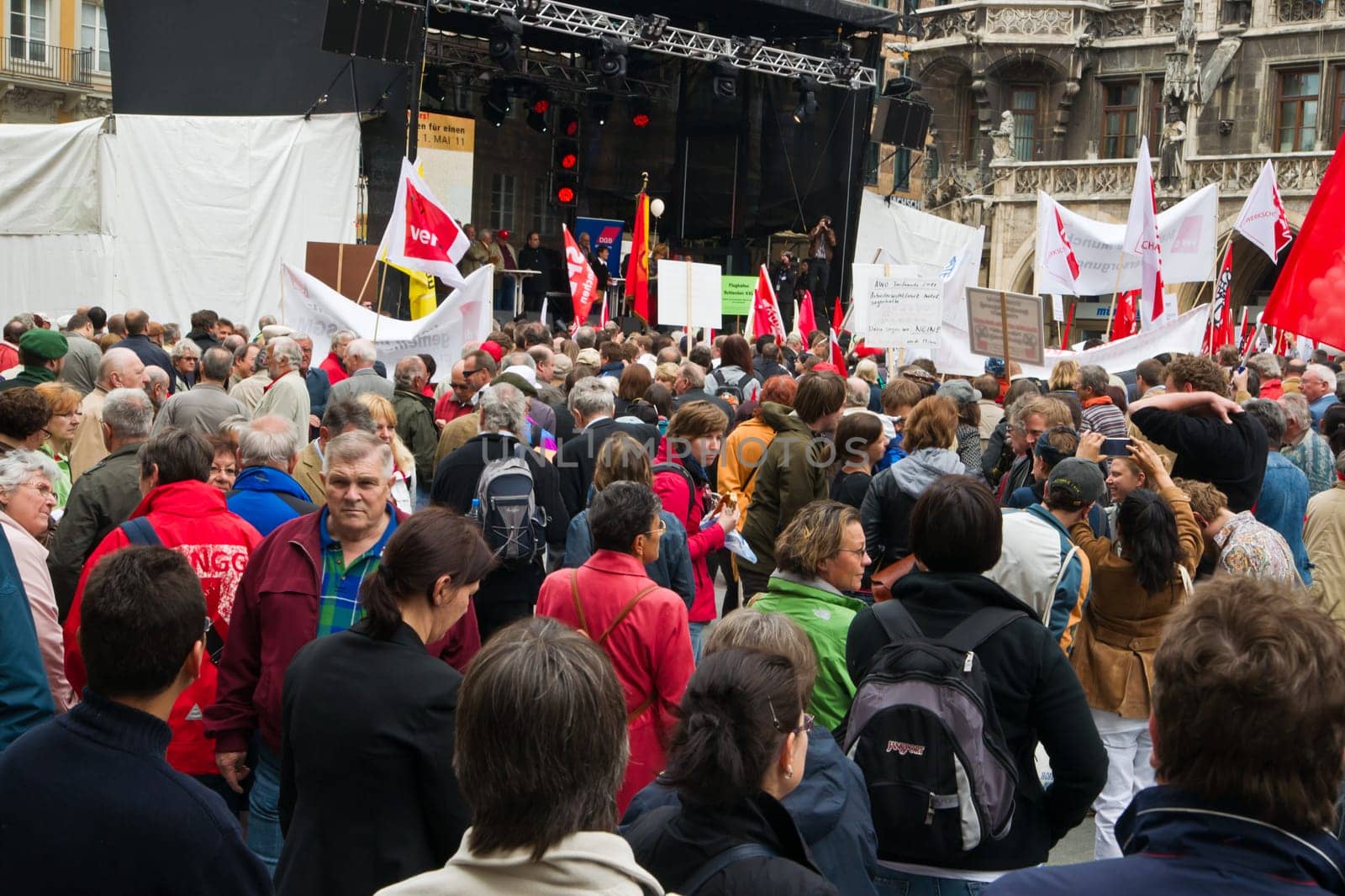 MUNICH,GERMANY - MAY 1st 2011: Many people participating in the rally at Munichs central Marienplatz in May Day,the international labour day,protesting against cuts in social welfare and low wages. May 1st,2011 in Munich,Germany.