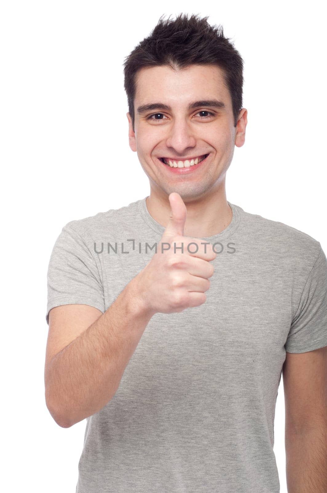 handsome young man with thumbs up on an isolated white background