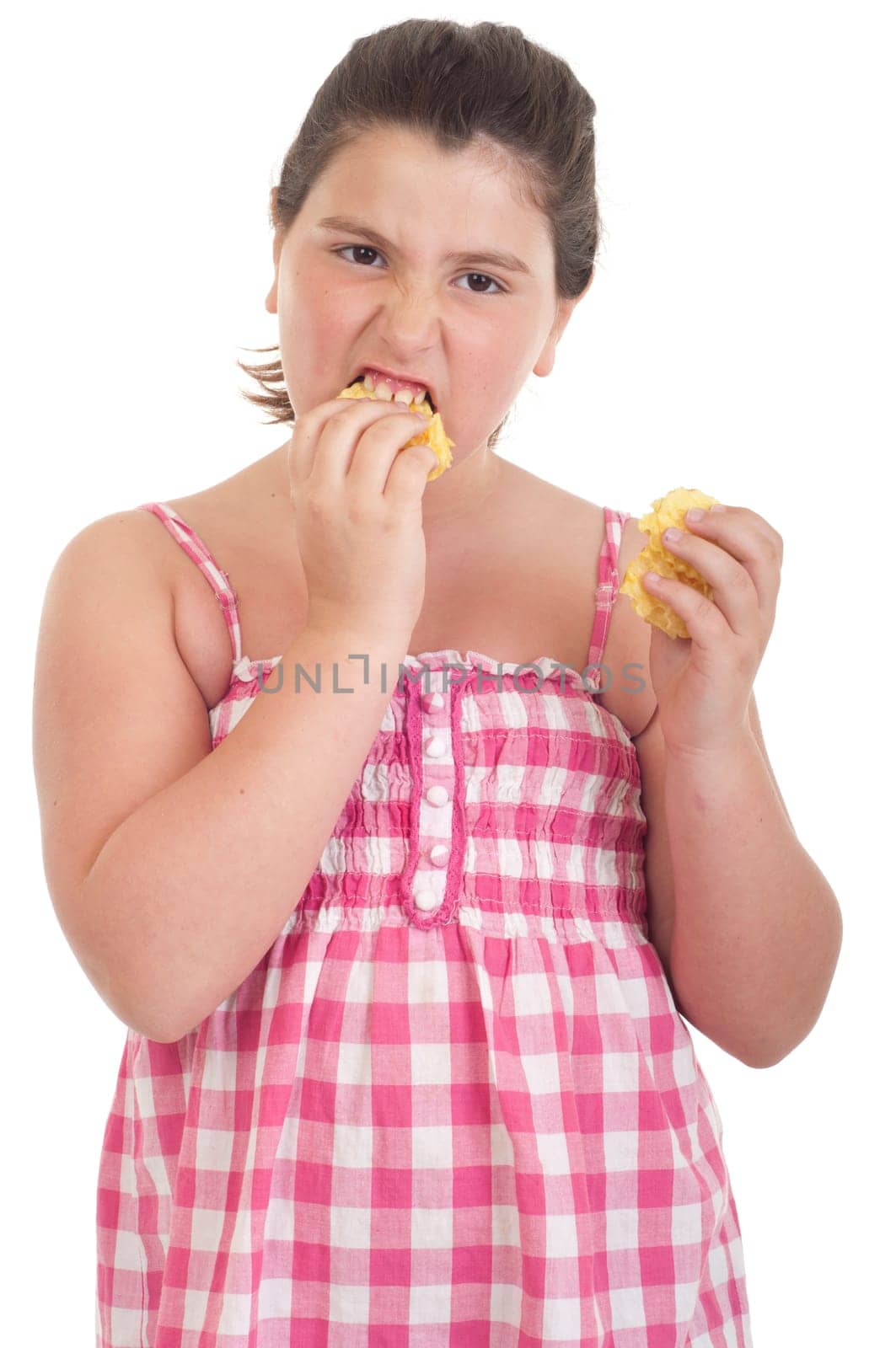 cute little girl with hungry expression eating chips (isolated on white background)