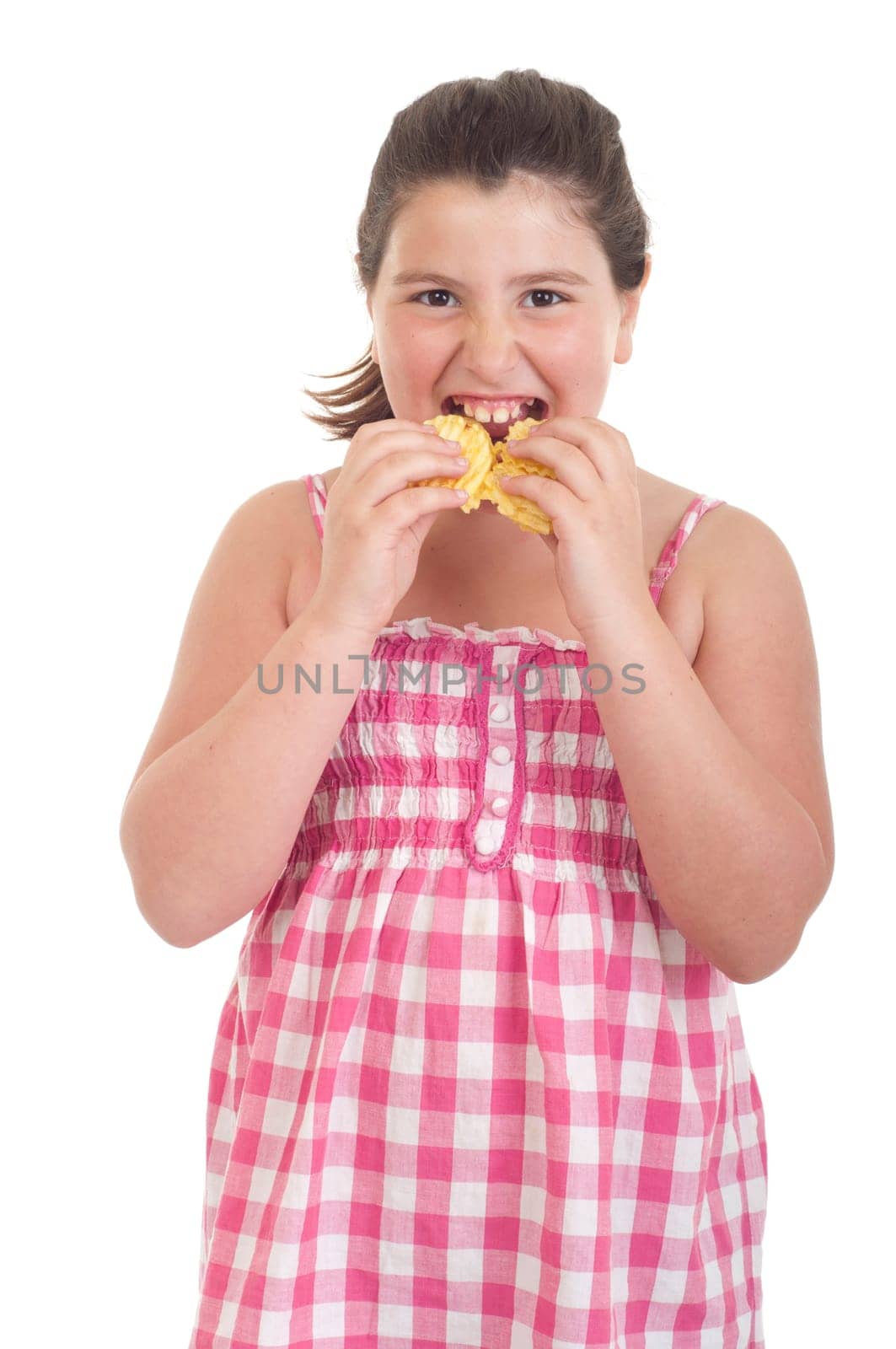 cute little girl with hungry expression eating chips (isolated on white background)