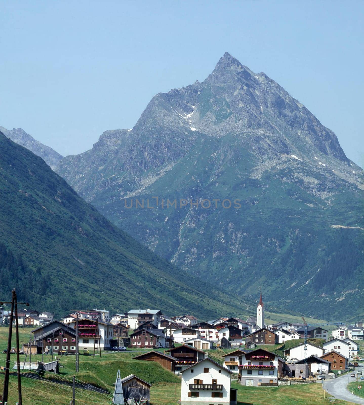 Swiss village with Alps in background