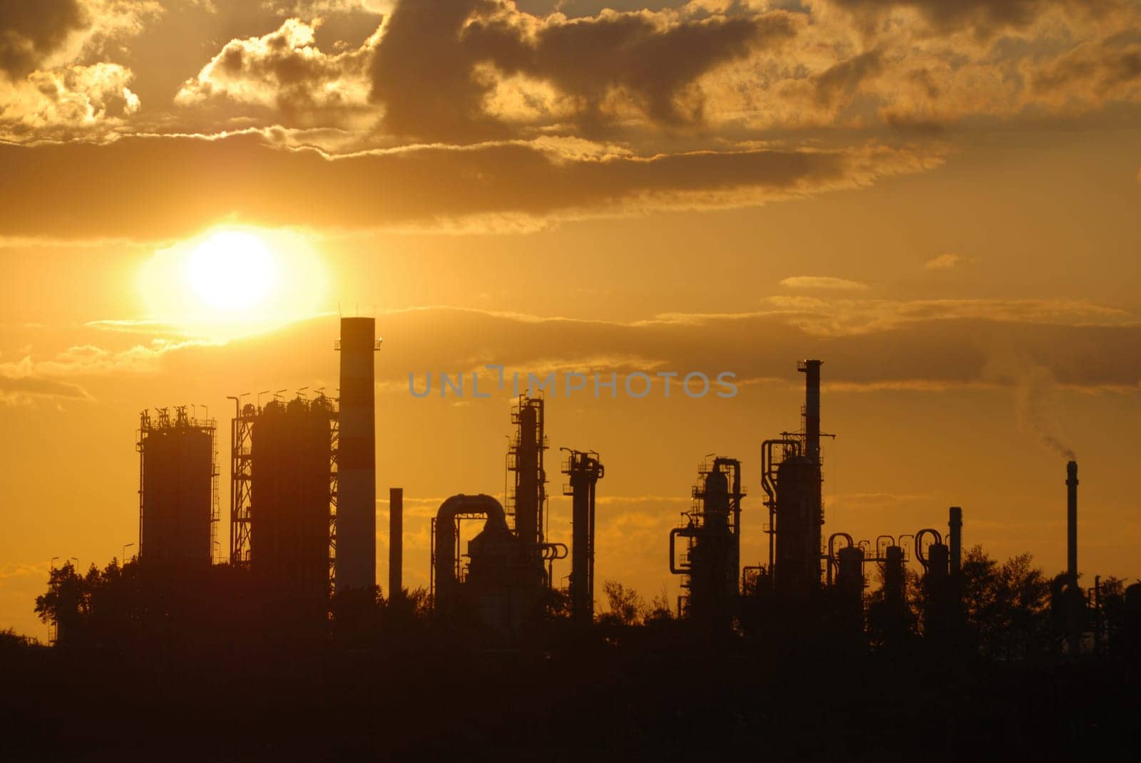 Oil refinery at sunset