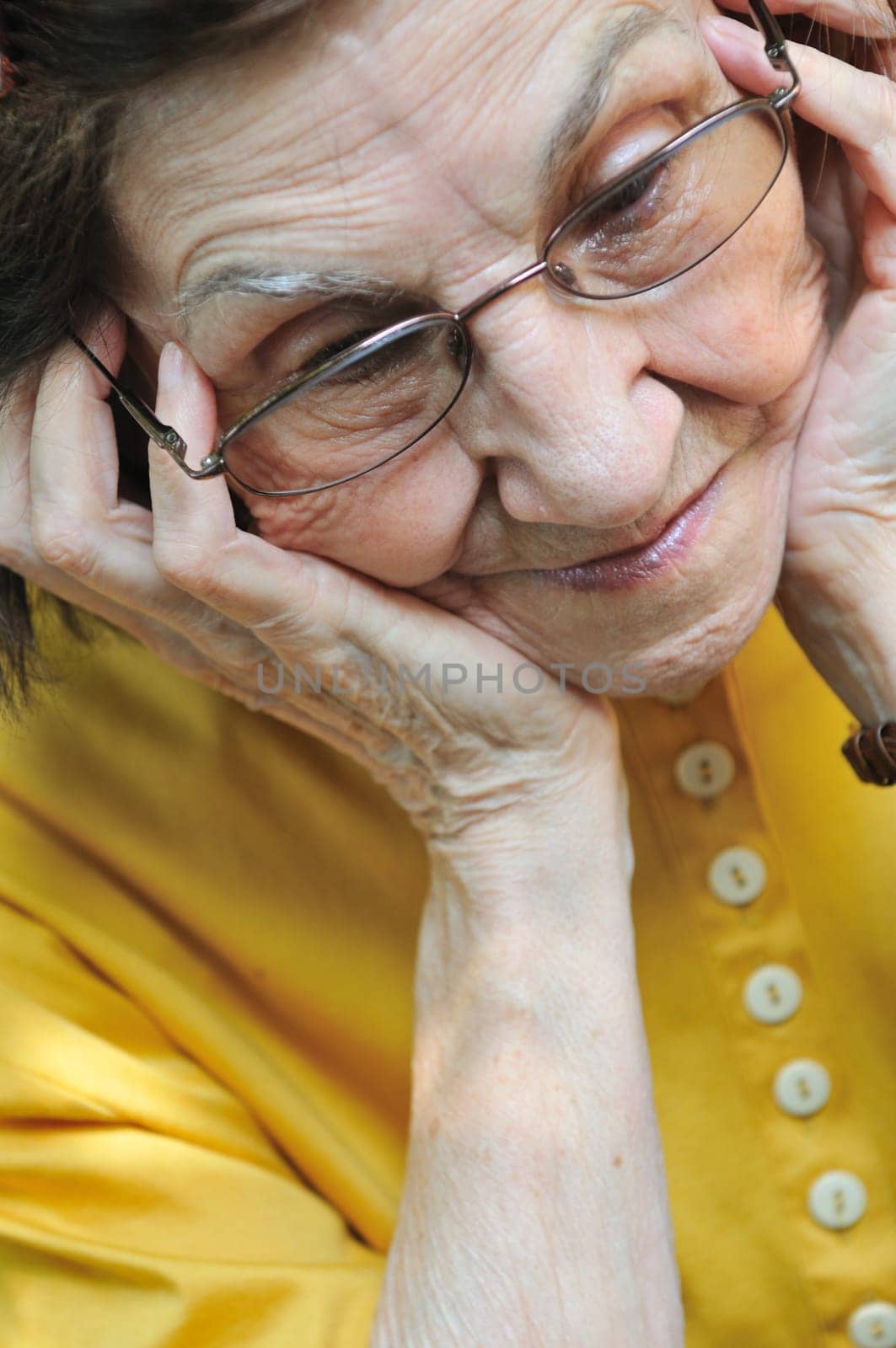 Solitude - portrait of worried senior woman
