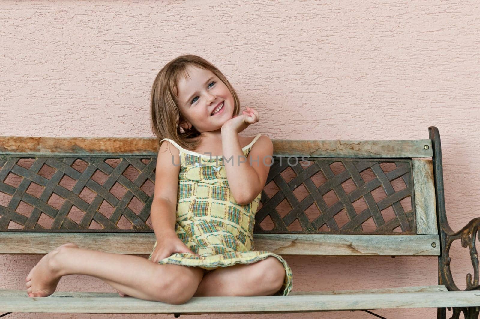 Outdoors portrait of small cute child - natural smiling expression