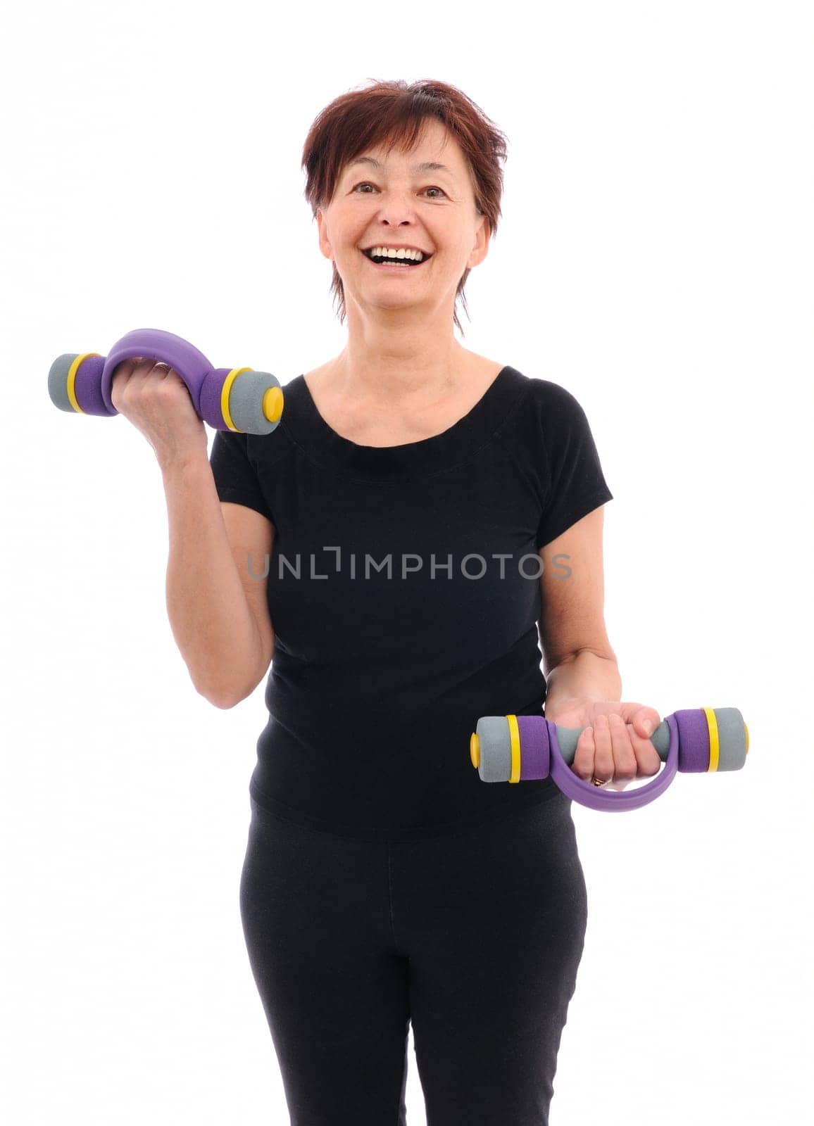 Smiling senior fitness woman with barbells