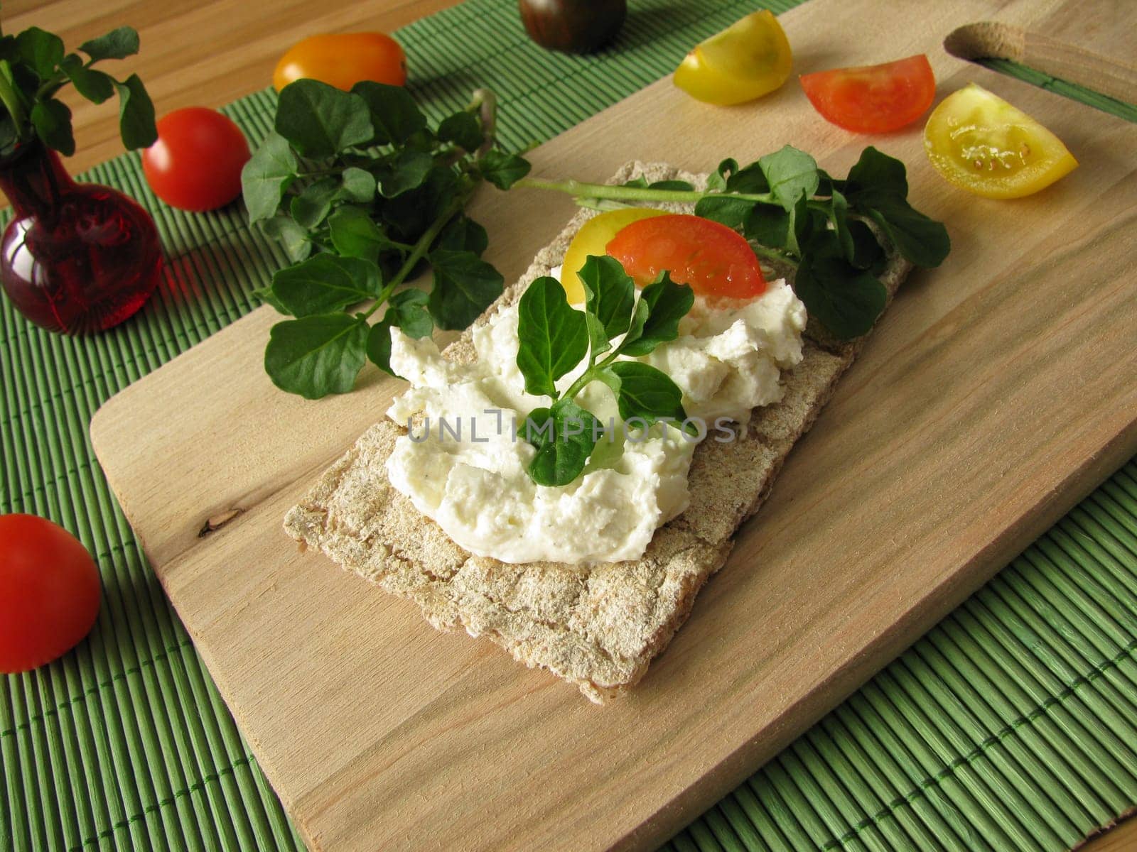 Cream cheese with watercress on crispbread