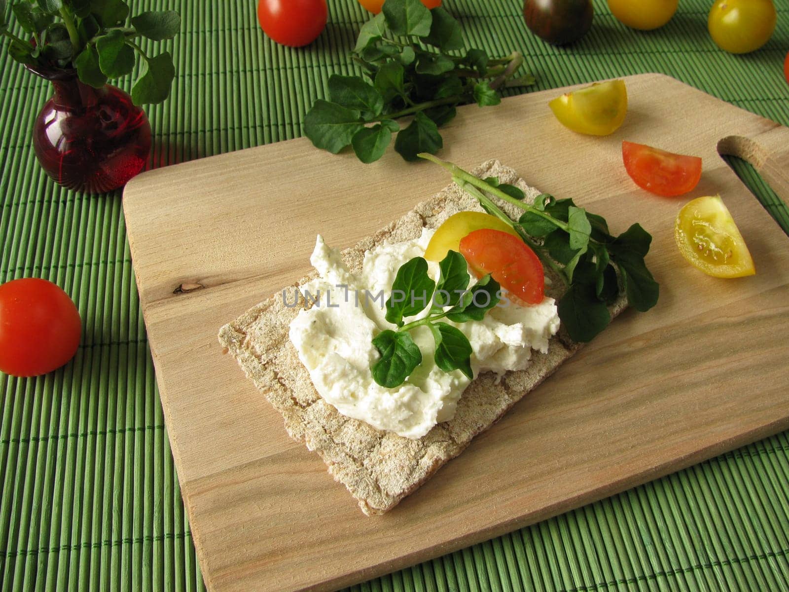 Cream cheese with watercress on crispbread
