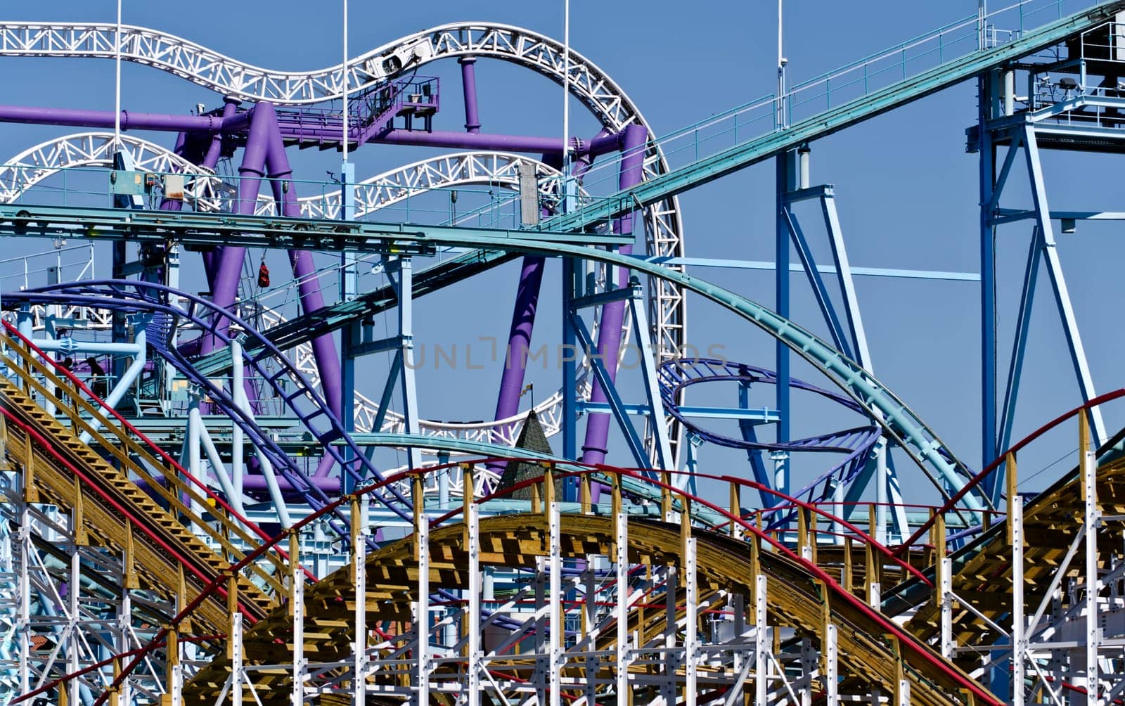 several roller-coaster tracks at an amusement park